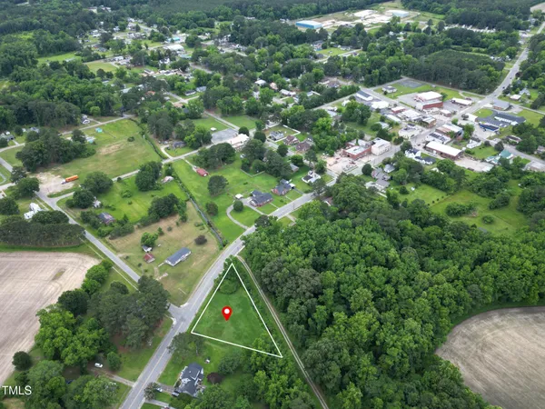 a view of field with trees in the background