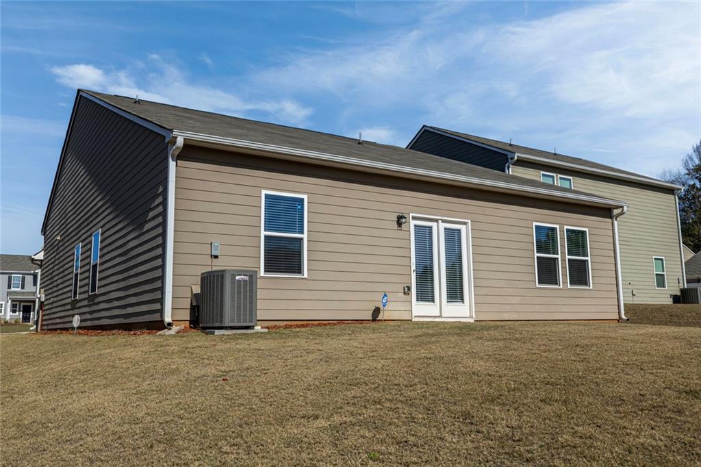 214 Georgian Way Locust Grove, GA 30248 - Photo 24 of 31 a backyard of a house