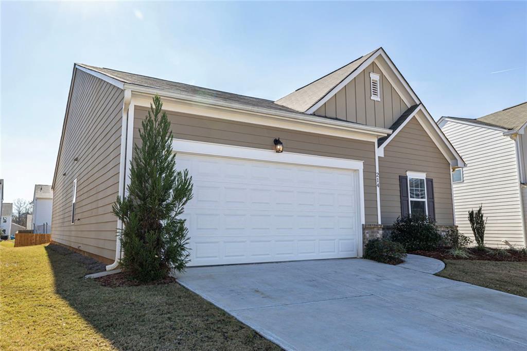 214 Georgian Way Locust Grove, GA 30248 - Photo 5 of 31 a front view of house with yard