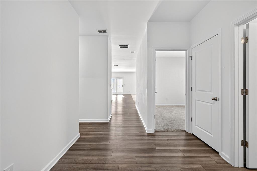 214 Georgian Way Locust Grove, GA 30248 - Photo 6 of 31 a view of a bathroom with wooden floor
