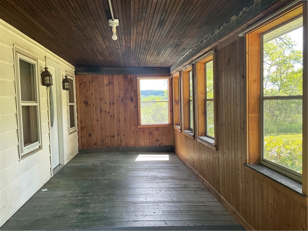 6801 Frazier Road Sempronius, NY 13118 - Photo 6 of 33 Welcoming enclosed front porch