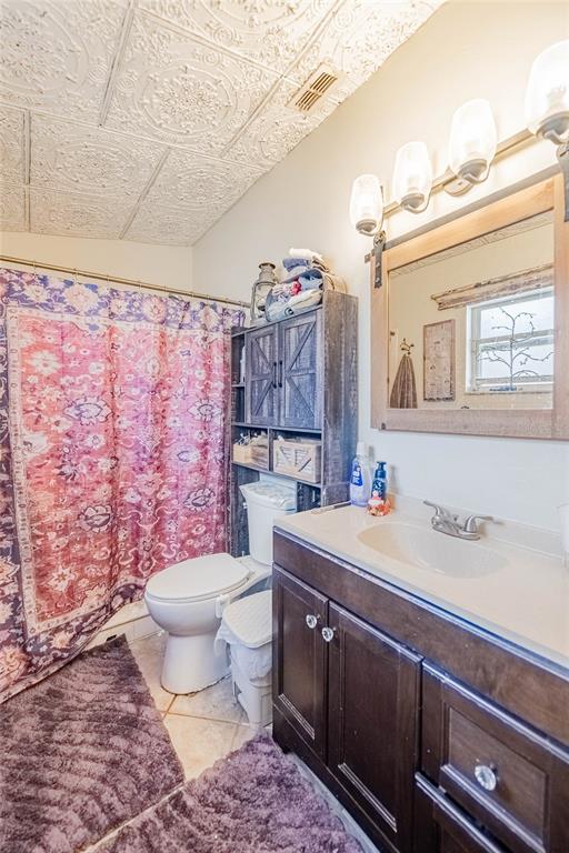 463 Emerald Cove Loop Lakeland, FL 33813 - Photo 19 of 30 a bathroom with a granite countertop toilet sink and mirror