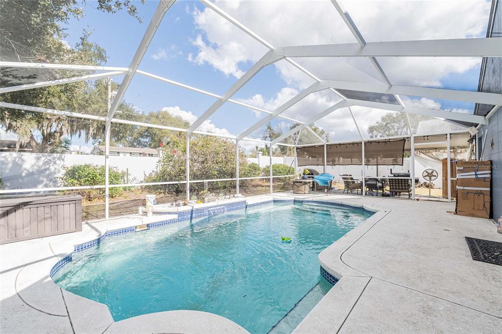 463 Emerald Cove Loop Lakeland, FL 33813 - Photo 2 of 30 a view of a swimming pool with a patio