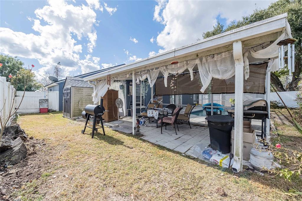 463 Emerald Cove Loop Lakeland, FL 33813 - Photo 29 of 30 a view of a backyard with a patio