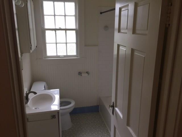 2915 Beanna Street Austin, TX 78705 - Photo 6 of 8 a bathroom with a sink toilet and window