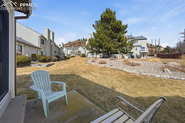 a view of a backyard with furniture