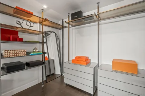 a bedroom with bed and wooden floor