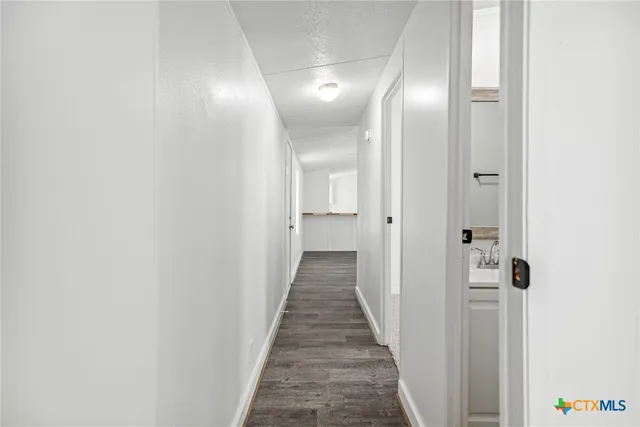 a kitchen with a sink and a window