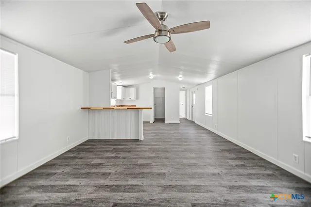 a large bathroom with a granite countertop sink and a large mirror