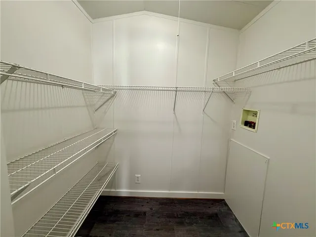 a view of a room with racks on the wall