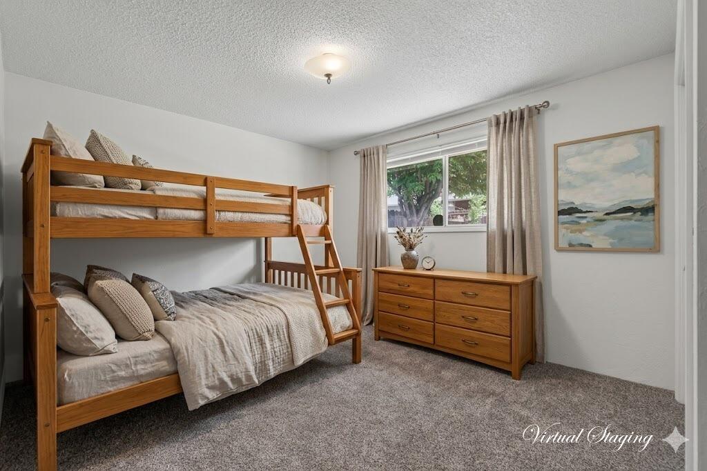 415 Sutter Avenue Medford, OR 97504 - Photo 16 of 28 a bed room with a bed and a window