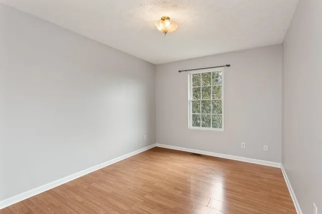 a bathroom with a sink mirror bathtub and toilet
