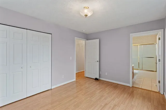 a bathroom with a bathtub and toilet