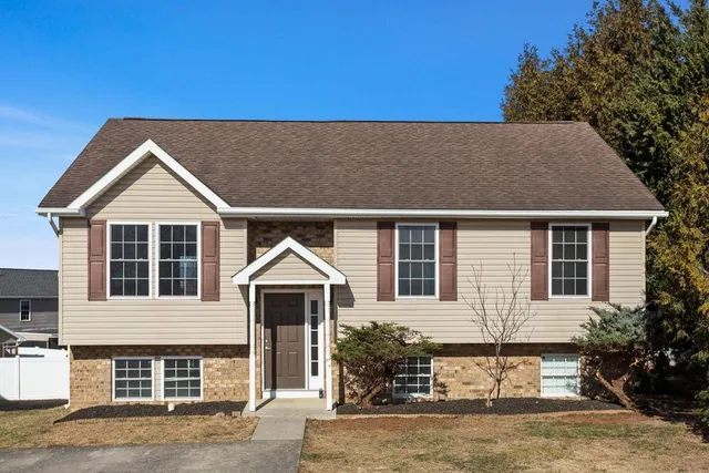 a front view of a house with a yard