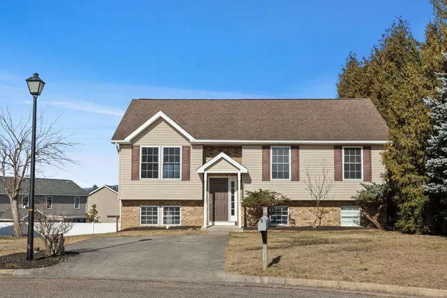 a view of multiple houses with city view