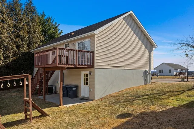a yellow house with trees in front of it