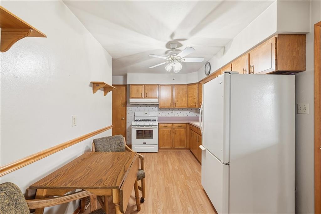 42 Lee Avenue Washington, PA 15301 - Photo 12 of 48 a kitchen with stainless steel appliances a refrigerator and a stove top oven