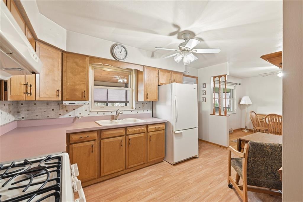 42 Lee Avenue Washington, PA 15301 - Photo 14 of 48 a kitchen with a refrigerator a sink and dishwasher a oven with wooden floor