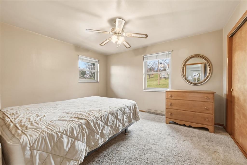 42 Lee Avenue Washington, PA 15301 - Photo 24 of 48 a bedroom with a bed and a chandelier