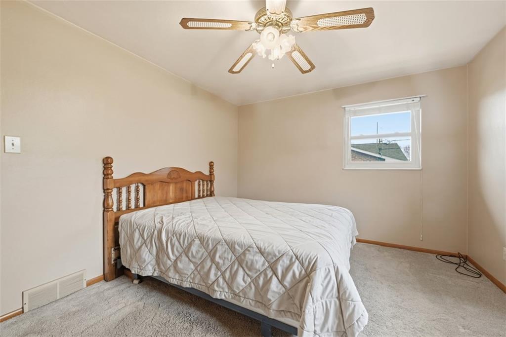 42 Lee Avenue Washington, PA 15301 - Photo 25 of 48 a bedroom with a bed and a chandelier