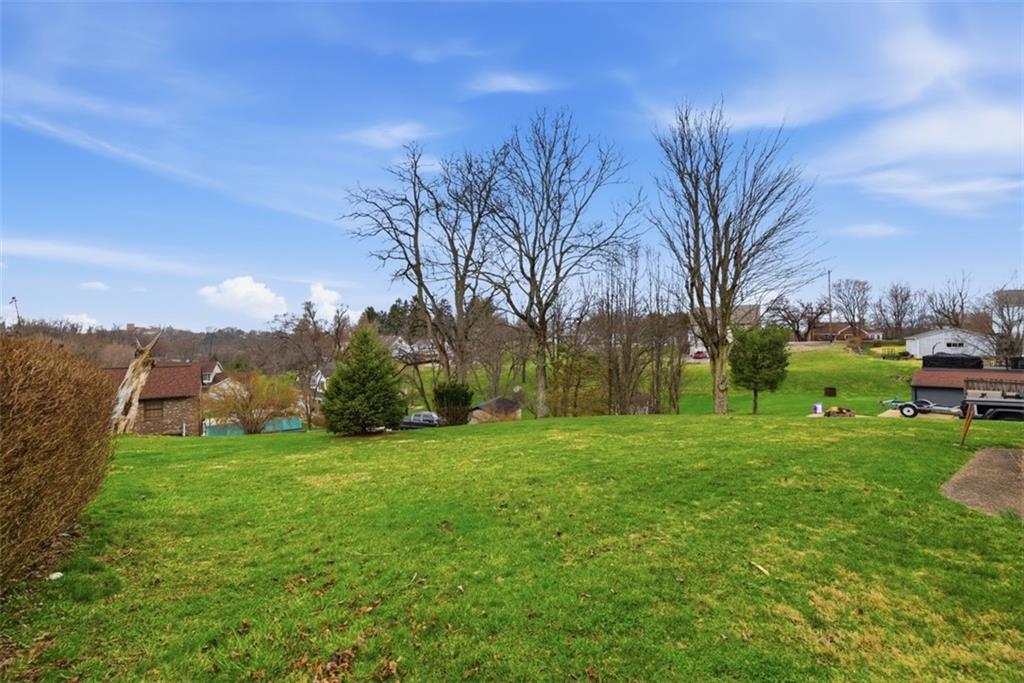 42 Lee Avenue Washington, PA 15301 - Photo 37 of 48 a view of a grassy field with trees around