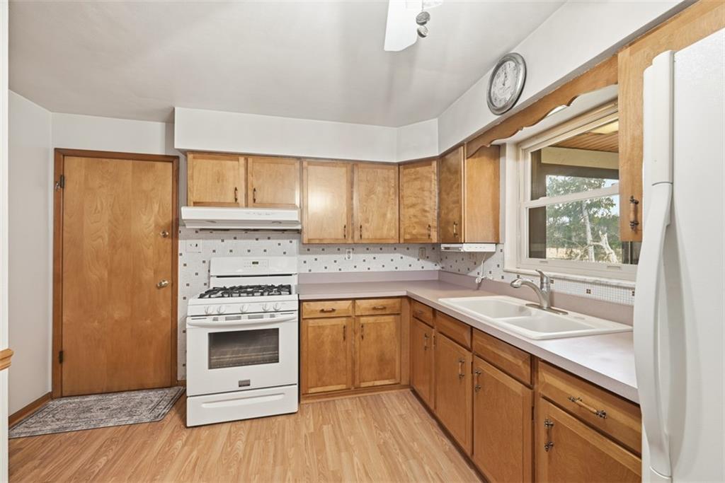 42 Lee Avenue Washington, PA 15301 - Photo 10 of 48 a kitchen with a sink stove and cabinets