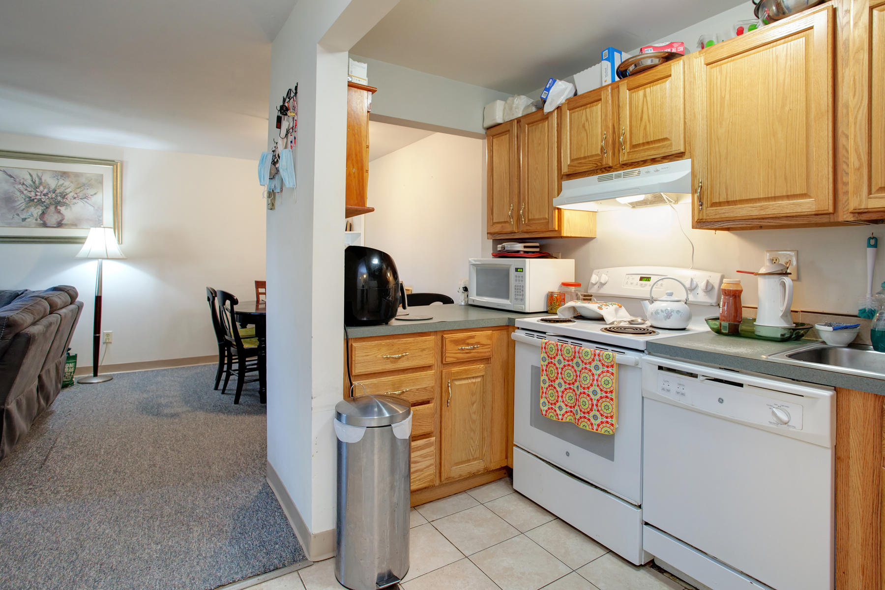 800 Bearses Way, Unit 4EF Hyannis, MA 02601 - Photo 12 of 22 a kitchen with stainless steel appliances a sink cabinets and a window