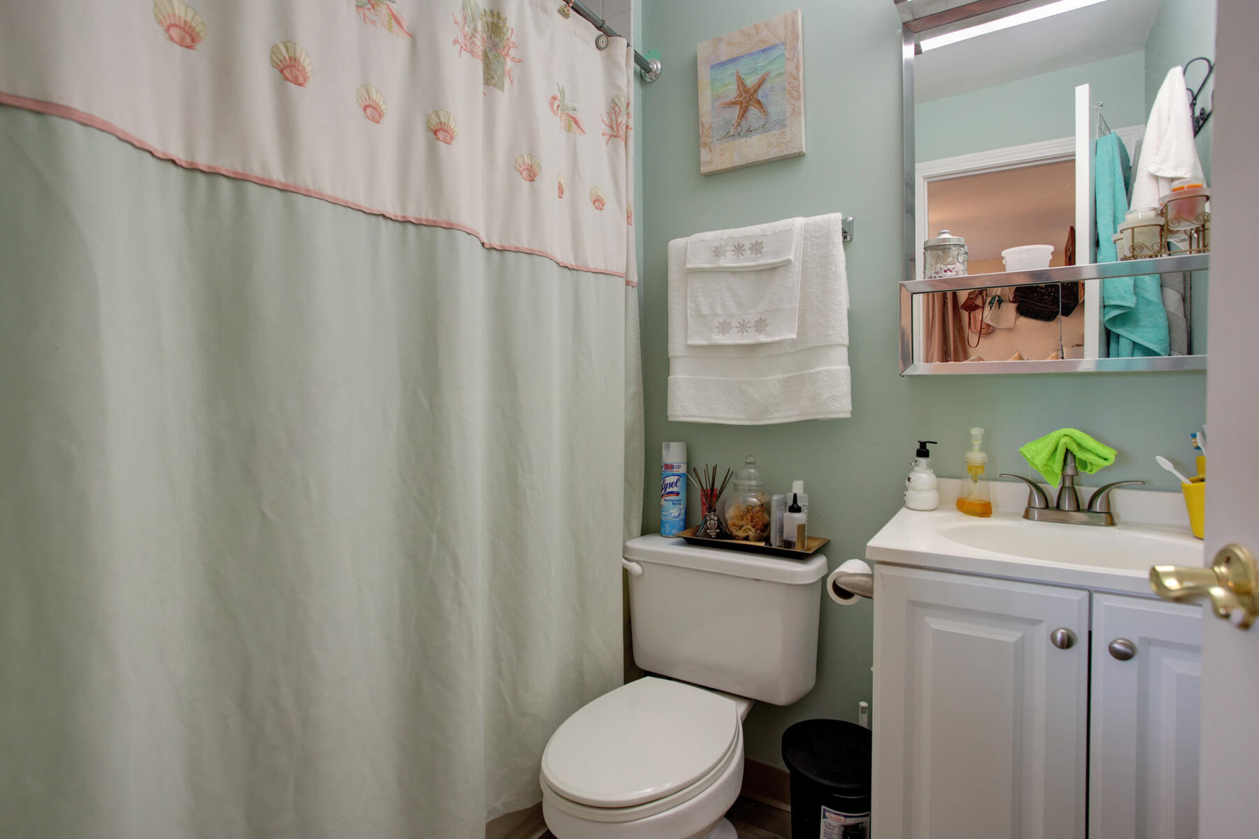 800 Bearses Way, Unit 4EF Hyannis, MA 02601 - Photo 15 of 22 a bathroom with a sink mirror vanity and toilet