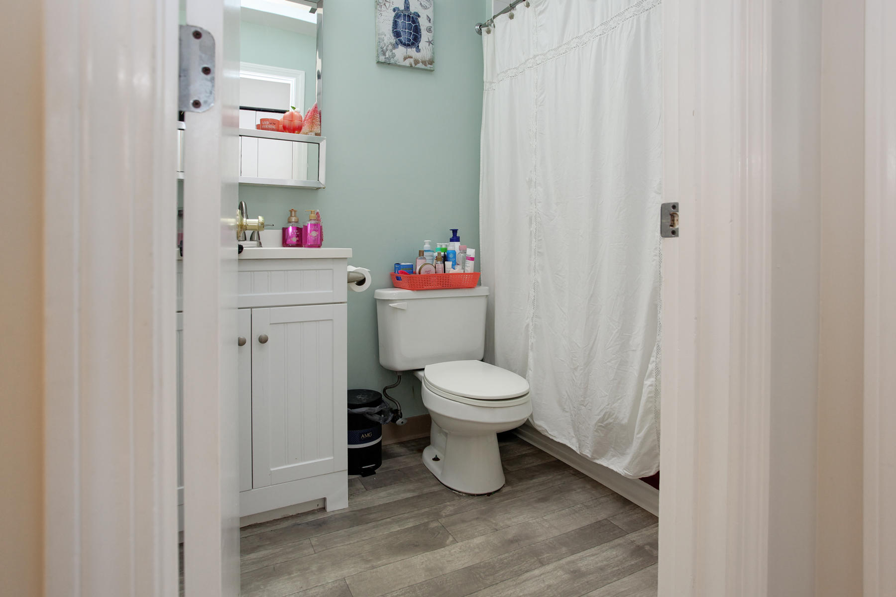 800 Bearses Way, Unit 4EF Hyannis, MA 02601 - Photo 17 of 22 a bathroom with a toilet and a shower curtain