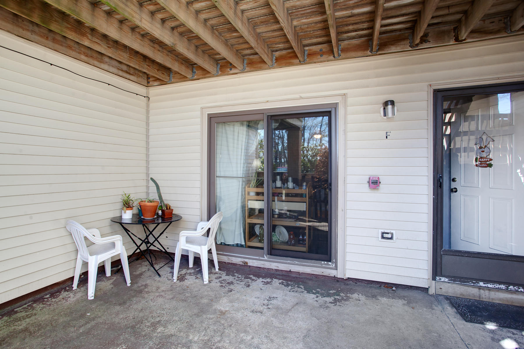 800 Bearses Way, Unit 4EF Hyannis, MA 02601 - Photo 5 of 22 a view of a room with chairs and table in a patio