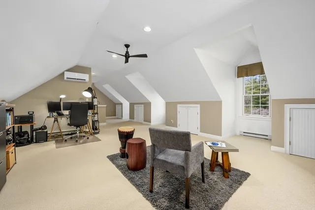 a living room with furniture a dining table and chairs with wooden floor