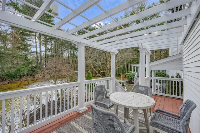 a view of a patio with a table and chairs