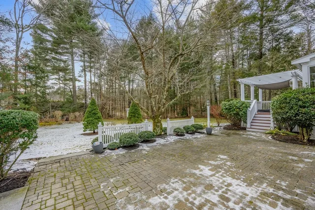 a view of a house with a yard and sitting area