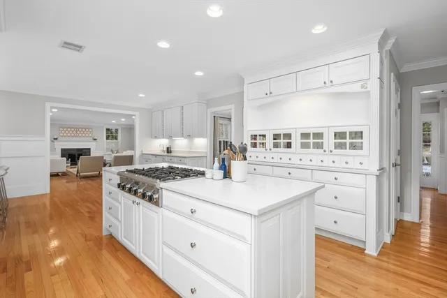 a kitchen with stainless steel appliances granite countertop a stove and a refrigerator