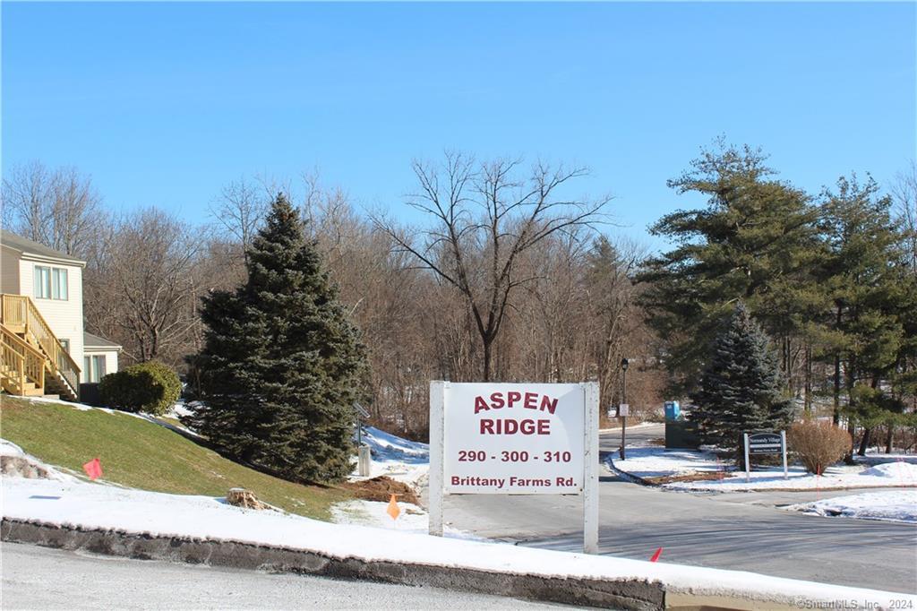 300 Brittany Farms Road, Unit C New Britain, CT 06053 - Photo 1 of 1 a sign on the side of a road
