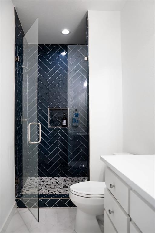 841 Meadowbend Loop South Grapevine, TX 76051 - Photo 19 of 20 a bathroom with a toilet and a shower