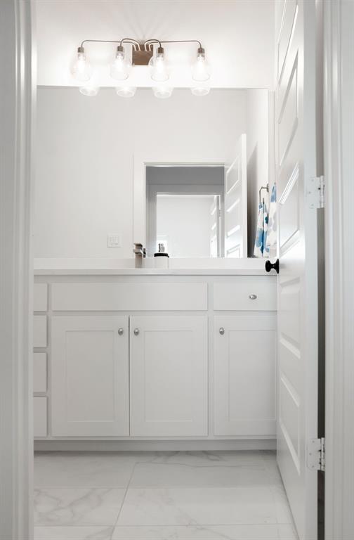 841 Meadowbend Loop South Grapevine, TX 76051 - Photo 20 of 20 a bathroom with a sink and a mirror