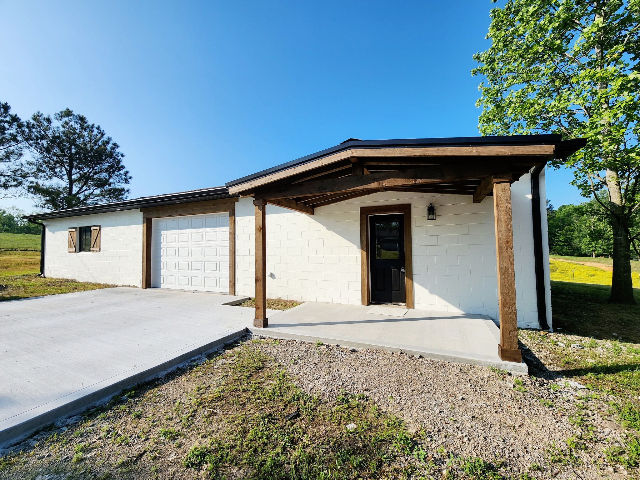 0 Kaiser Road Dickson, TN 37055 - Photo 1 of 14 a front view of a house with garden