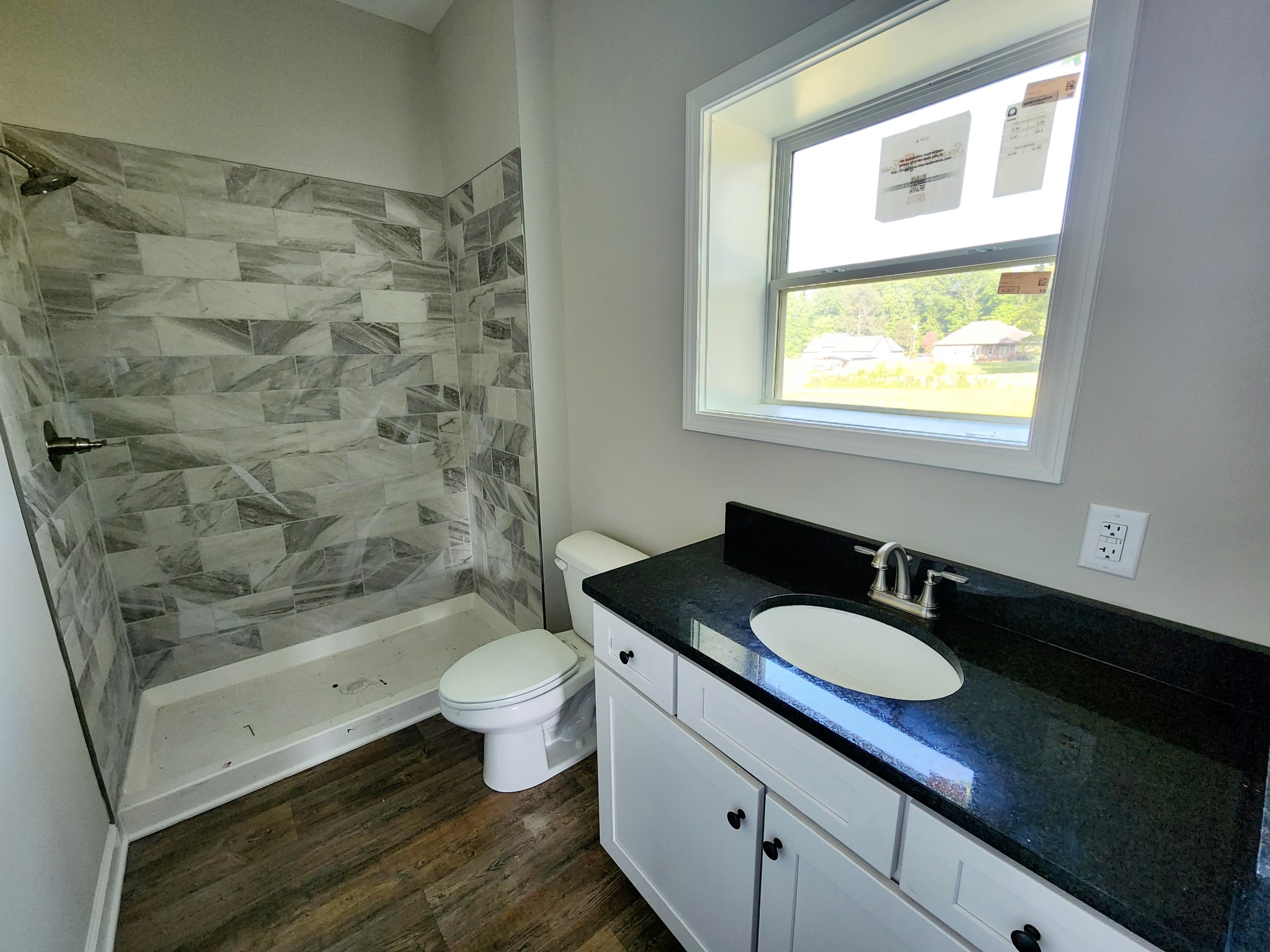 0 Kaiser Road Dickson, TN 37055 - Photo 11 of 14 a bathroom with a granite countertop sink toilet and shower
