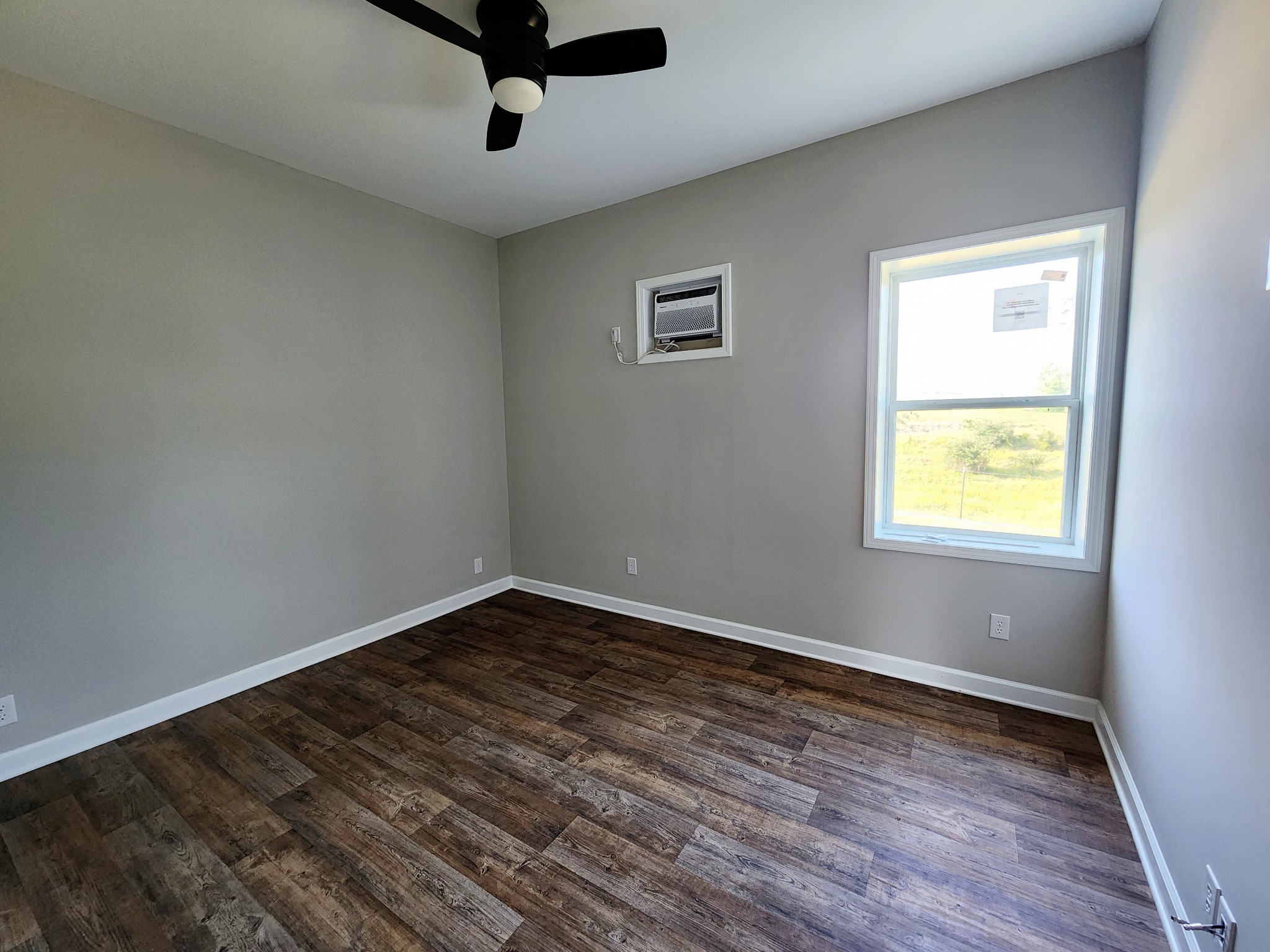 0 Kaiser Road Dickson, TN 37055 - Photo 10 of 14 a view of an empty room with wooden floor and a window
