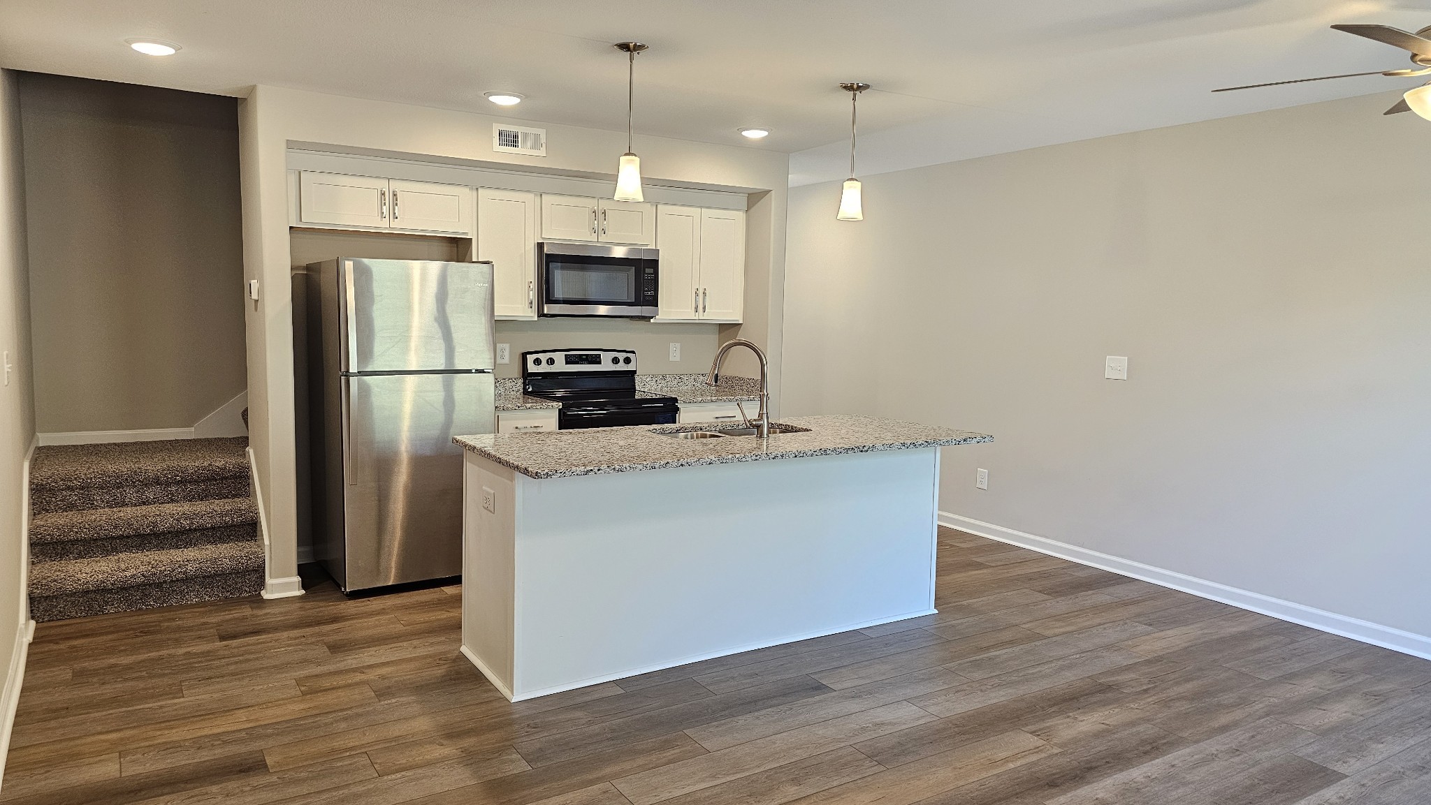 947 Center Road, Unit B Clarksville, TN 37042 - Photo 3 of 24 a kitchen with stainless steel appliances a refrigerator sink and microwave