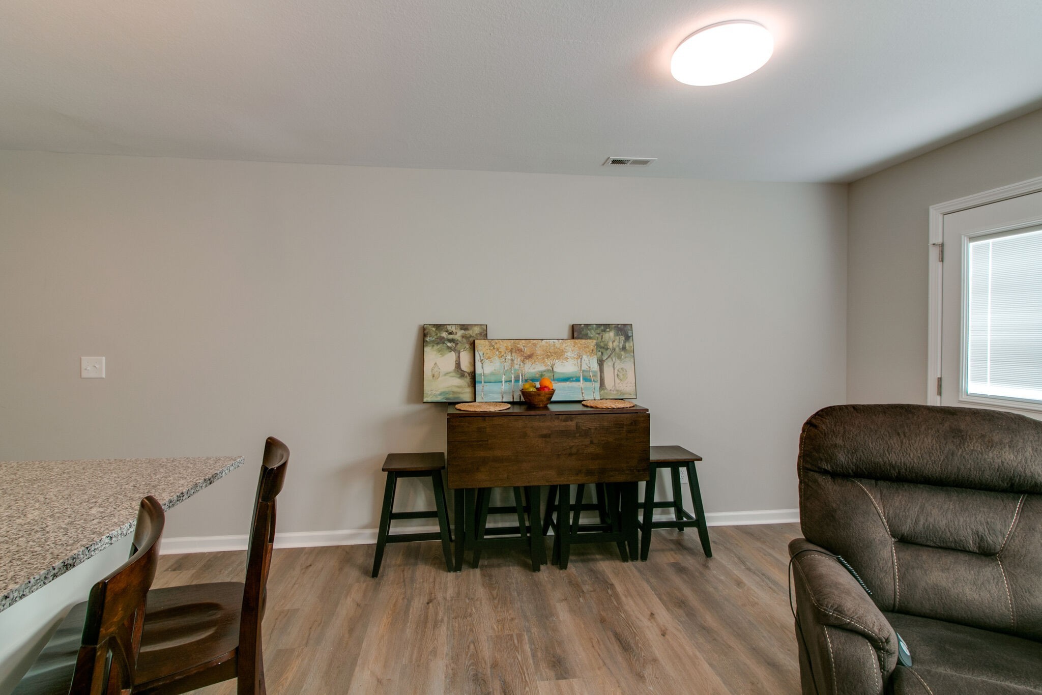 947 Center Road, Unit B Clarksville, TN 37042 - Photo 7 of 24 a view of a workspace with furniture and wooden floor