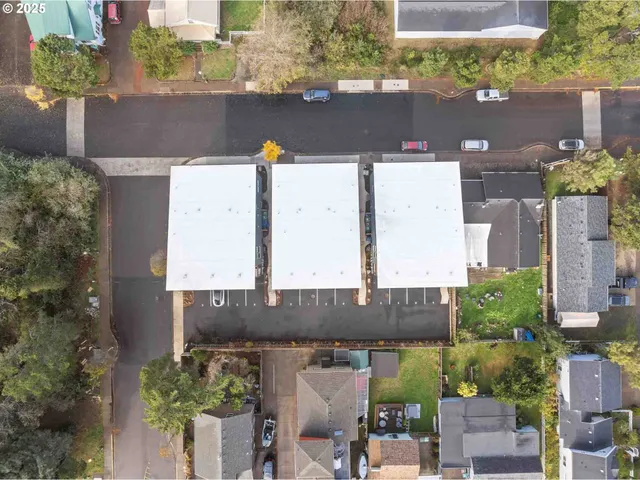 an aerial view of a house with a yard