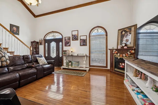 a living room with furniture and a flat screen tv