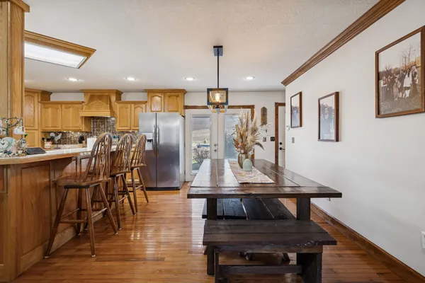 a view of a dining room with furniture window and wooden floor