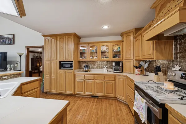 a kitchen with stainless steel appliances granite countertop a sink and cabinets