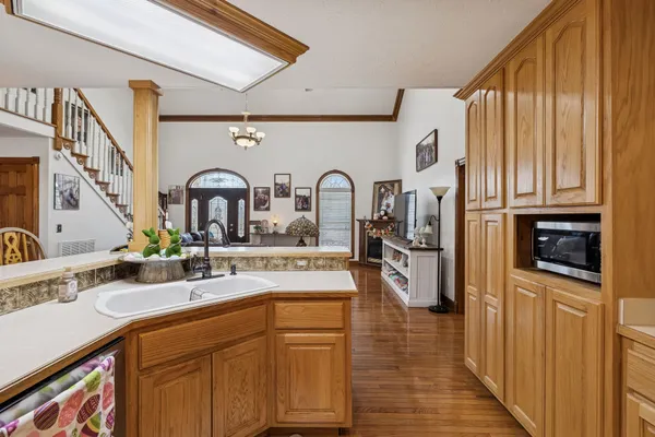 a kitchen with stainless steel appliances granite countertop a sink and cabinets
