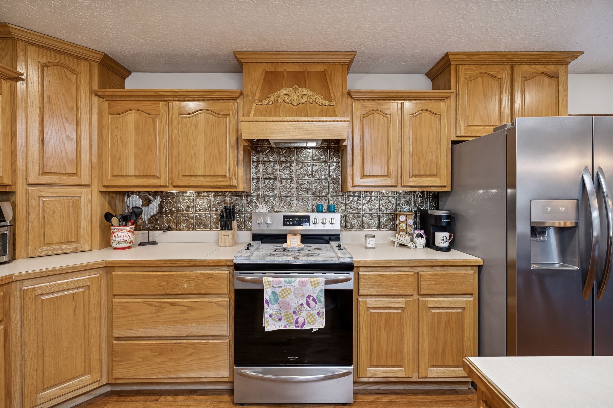389 Trace Creek Road Red Boiling Springs, TN 37150 - Photo 21 of 57 a kitchen with stainless steel appliances granite countertop a sink stove and refrigerator
