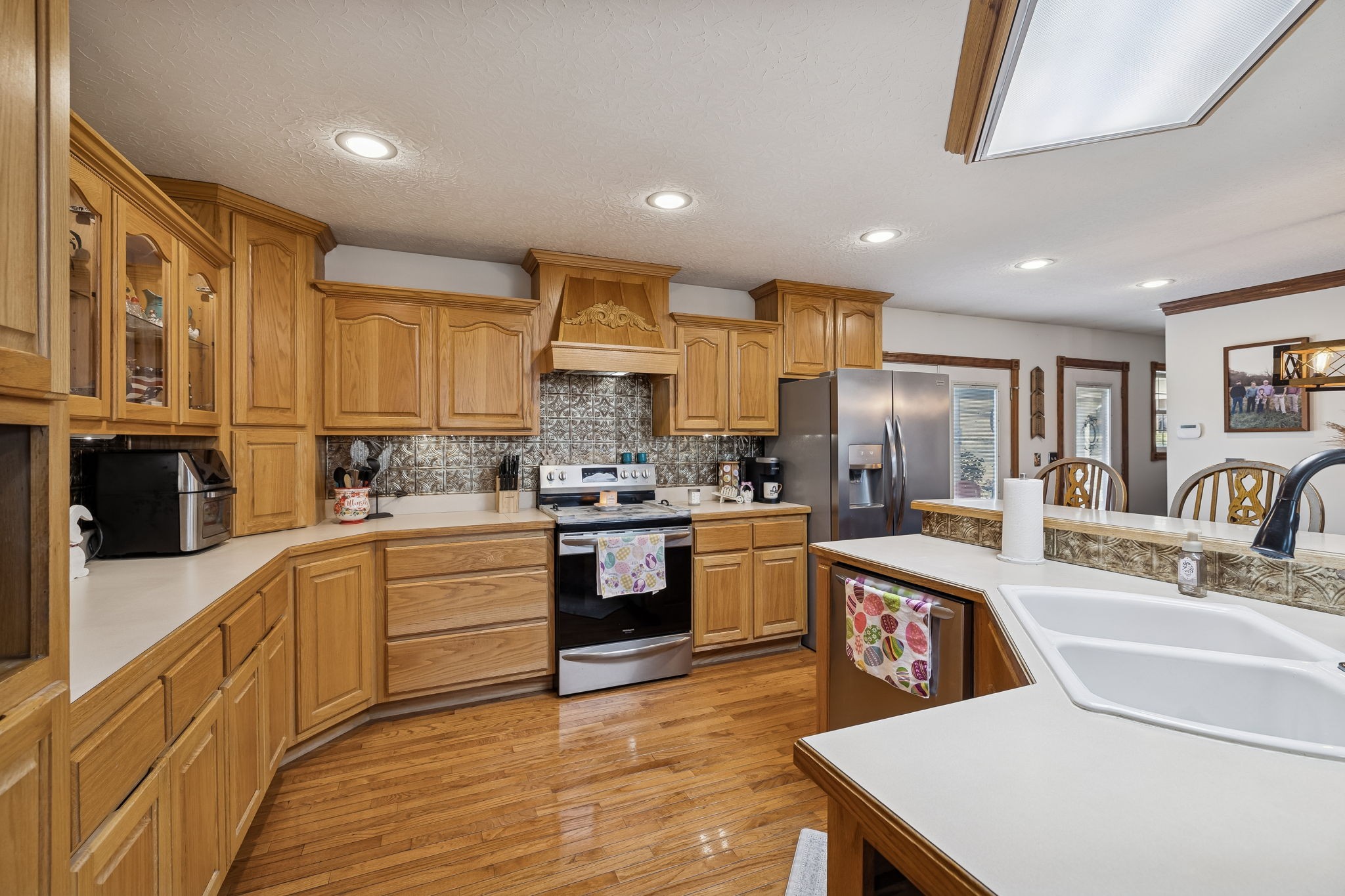 389 Trace Creek Road Red Boiling Springs, TN 37150 - Photo 22 of 57 a kitchen with stainless steel appliances granite countertop a sink dishwasher stove refrigerator and cabinets