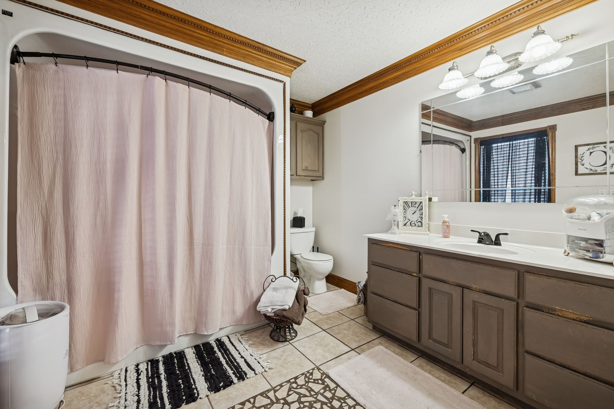 389 Trace Creek Road Red Boiling Springs, TN 37150 - Photo 27 of 57 a bathroom with a double vanity sink and a mirror